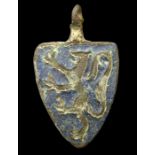 Medieval Harness Pendant  Circa, 13th century AD. Copper-alloy, 7.4 grams. 36mm. A shield shaped