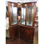 Two twentieth century corner display cabinets with mirrored interiors and cupboards in the lower