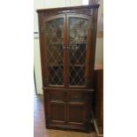 An early 20th Century corner glazed cupboard. 168cm H