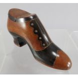 A mid 19th Century carved treen table snuff shoe, inlaid brass tack, hinged cover, width 12cm