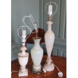 A group of three table lamps - two onyx examples and a white glass-bodied lamp. 56 - 80 cm tall. (