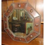 An early twentieth century oak octagonal mirror 60 cm wide.