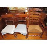 A group of three nineteenth century chairs: a pair of mahogany dinning chairs and a rush-seated