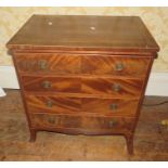 An early 19th Century mahogany and satinwood strung chest of drawers in small proportions, slight