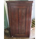 A nineteenth century oak corner cupboard. 105 cm tall.