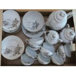 A Japanese ceramic tea service decorated with island scenes. To include: 12 saucers, 12 side plates,
