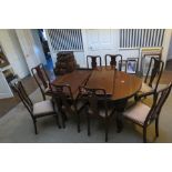 A Queen Anne revival mahogany dining table, oval top carved edge, pull out extending with leaves,