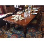 A Victorian walnut dining table, the rectangular extending top with moulded edge, on reeded