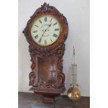 A walnut Vienna clock by Thos. Armstrong & Co of Manchester. With pendulum. 110cm tall.