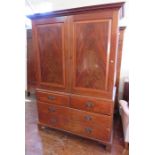 A flamed mahogany linen press; two doors and fours drawers. 123cm wide.