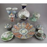 A group of modern Chinese and Oriental decorative ceramics to include vases, covered jars, goblets