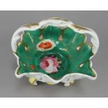 An early nineteenth century English porcelain handled and footed basket, c. 1820-30. It is hand-