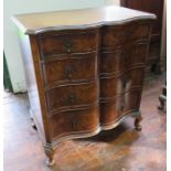 A walnut chest of drawers on cabriole legs with serpentine front. 77 cm wide.