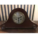 A mid 20th Century mahogany arched bracket clock with Westminster chiming mechanism (pendulum)