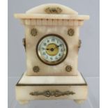 A small size alabaster type bracket clock with ormolu mounts. 19 cm tall.  Some damages.
