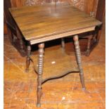 An early twentieth century oak square side table with turned legs and lower shelf. 46 w, 62 cm tall.