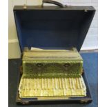 A cased Settimo Soprano 'Cardinal' piano accordion with glitter and bejewelled celluloid body.57cm