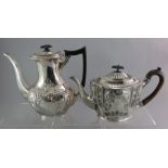 A silver hallmarked teapot and coffeepot, one with ebonised handle.  1480g