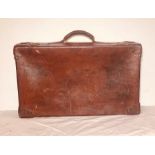 1930's brown leather suitcase, brass mounted locks engraved with "Secure Lever" on, leather stitched