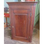 A nineteenth century oak wall hanging corner cupboard with H hinges. 111 cm tall.