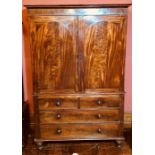 A William IV Scottish mahogany linen press, circa 1835, moulded cornice above two outset panel doors