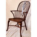 An 18th Century yew and elm Windsor armchair with