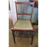 A nineteenth century mahogany child's chair with green upholstered seat and inlayed frame. Turned