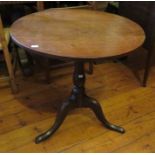 A nineteenth century oak tilt-top circular table. 70 cm wide.
