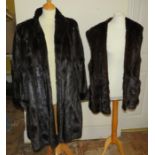 A full length ranch fur coat in black 1960s together with a dark brown gilet 1970s.