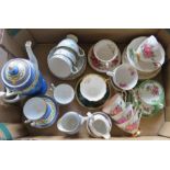 A collection of ceramic tea wares to include: cups and saucers, plates, coffeepot, cream and
