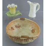A group of early twentieth century Worcester porcelain pieces to include: A Blush Ivory basket, a