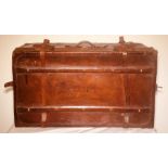 An early 20th century French leather travelling trunk suitcase, brass locks engraved with "