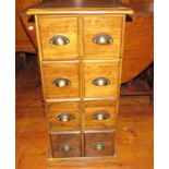 A modern stained pine set of card drawers. 40 cm wide, 40 cm deep, 80 cm tall