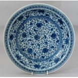 A Chinese blue and white charger, Greek key border containing scrolling foliage, blue seal