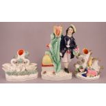 A group of late nineteenth century Staffordshire spill figure groups, c. 1860-70. To include: a