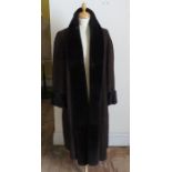 A full length suede/sheepskin dark brown coat by Nicole Farhi.