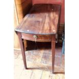 An early 19th century mahogany Pembroke table, circa 1810, oval shape top with drop leaves fitted