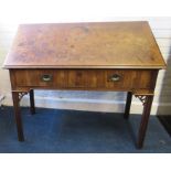 A George III figural mahogany architects table with fitted frieze drawer and ratcheting top.