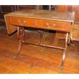 A twentieth century inlayed mahogany sofa table with folding ends and leather tops. 89cm long.