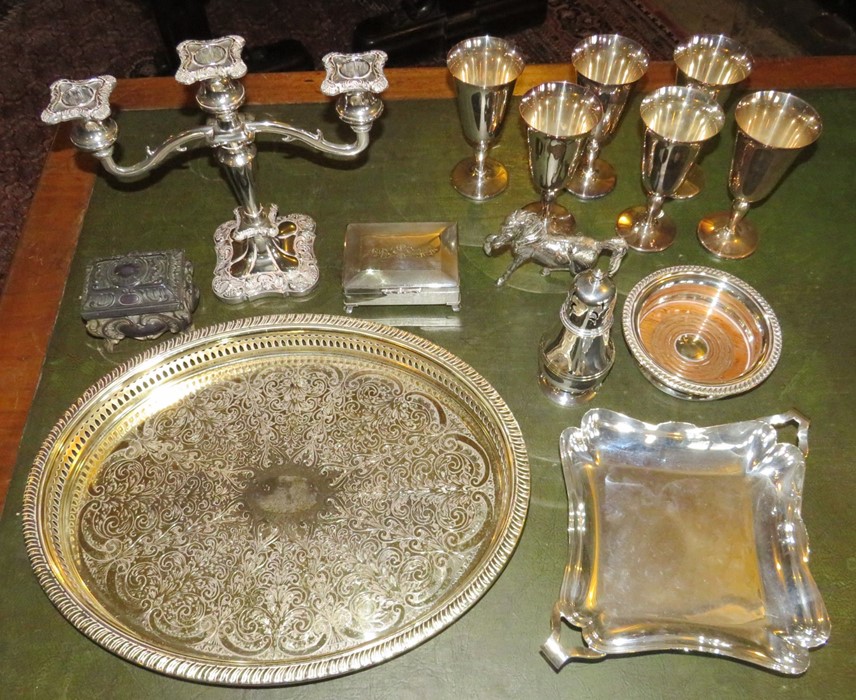 A group of plated ware, to include: a decorative horse, sugar sifter, two serving dishes, six