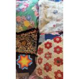 A quantity of quilt pieces, assorted colours and designs, from different eras, damaged pieces,
