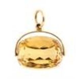 A 9ct gold mounted faceted topaz swivel fob, the t