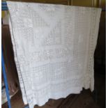 A large white bedspread in drawn thread work c.1910.