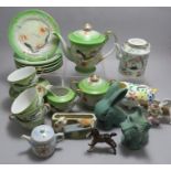 An early twentieth century Japanese tea service moulded with dragons and picked out in colours.