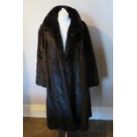 A full length ranch dark brown mink coat 1970s fully lined by Saga Mink. (1)