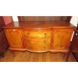 A twentieth bowfront oak sideboard on cabriole legs with two doors and three drawers. 153cm long.