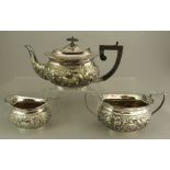 A three-piece EPNS tea service to include a teapot, sugar and creamer.  J C & Co., (3)