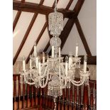 A clear cut glass fourteen light pendant chandelier, with facet cut glass droppers, drop