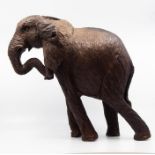 An ironwood large size carved elephant. One ear broken, part present.