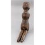 An 18th Century carved wooden doll, inset glass ey